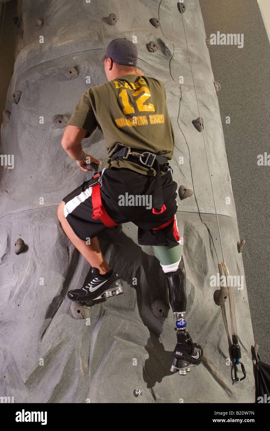 US Soldier with prosthetic leg learns to climb a rock wall again Injuries from the Iraq war EDITORIAL ONLY Stock Photo