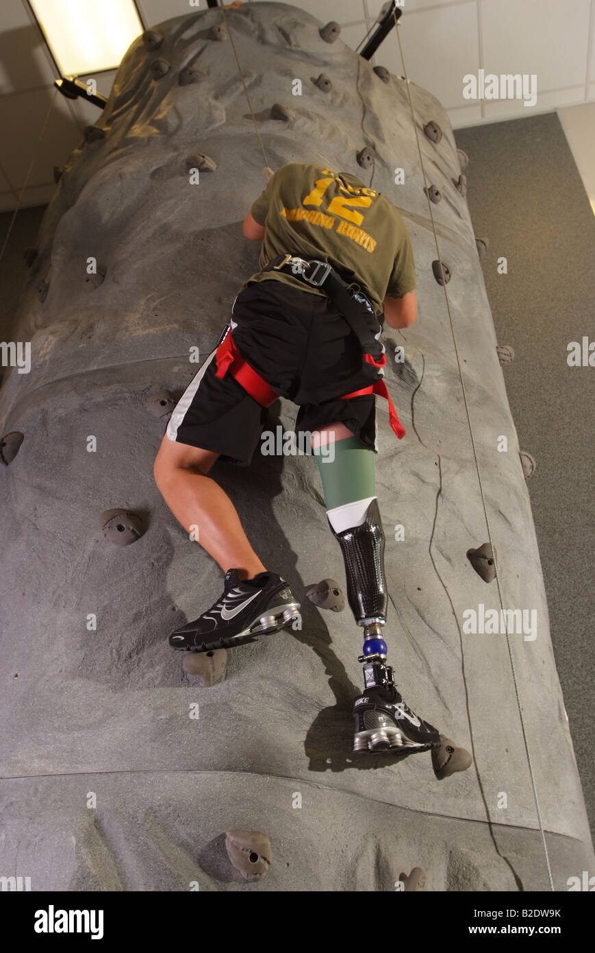 US Soldier with prosthetic leg learns to climb a rock wall again Injuries from the Iraq war EDITORIAL ONLY Stock Photo