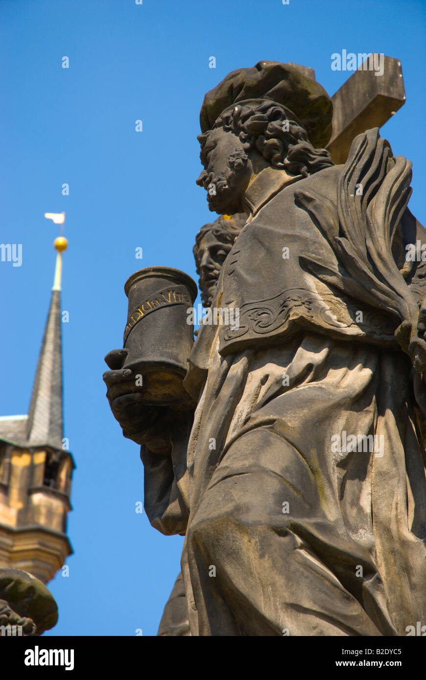 Statue of St Cosmas and St Damian on Charles Bridge in Prague Czech Republic Europe Stock Photo