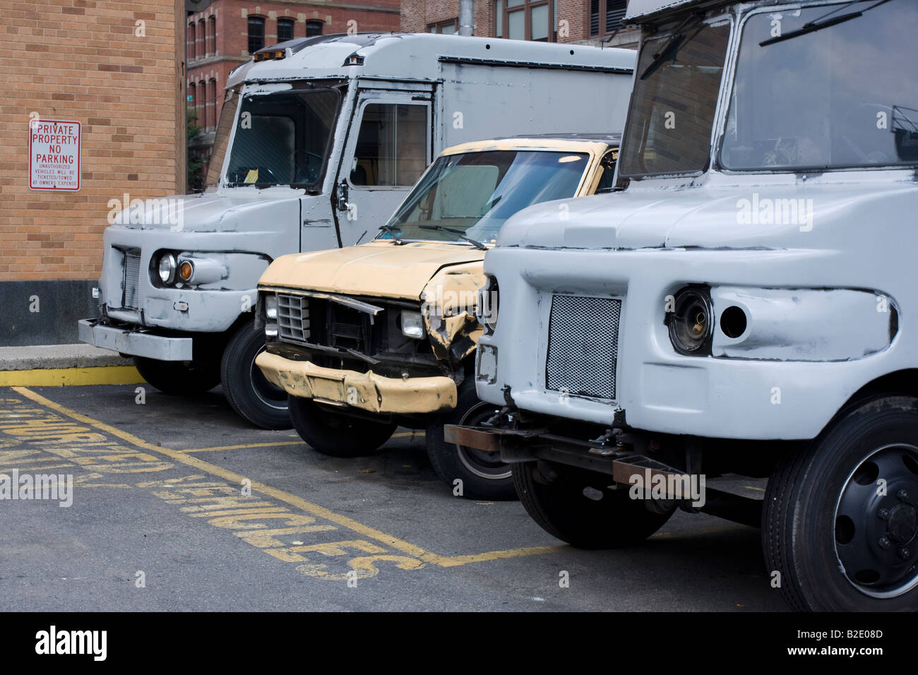 Two former UPS vans and a wrecked ford van parked in Tribeca, Manhattan, NY Stock Photo