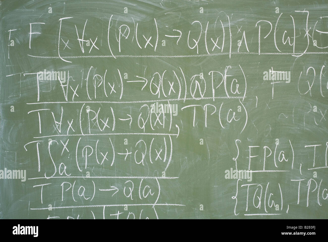 Math formulas written on the desk in classroom Stock Photo