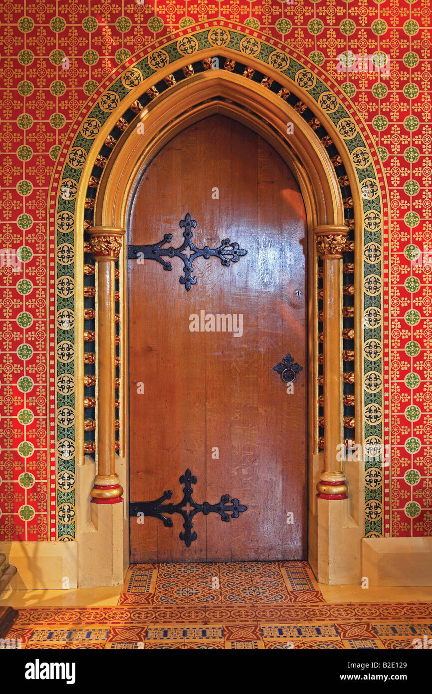 Gothic door with ornate Minton tiles designed by A.W.N. Pugin, St Giles church, Cheadle, Staffordshire, England Stock Photo