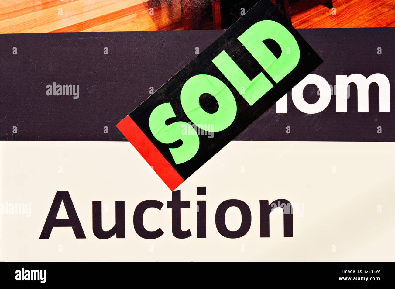 Housing Property Market / A Property Auction Hoarding Board, displaying a "Sold Sign" poster