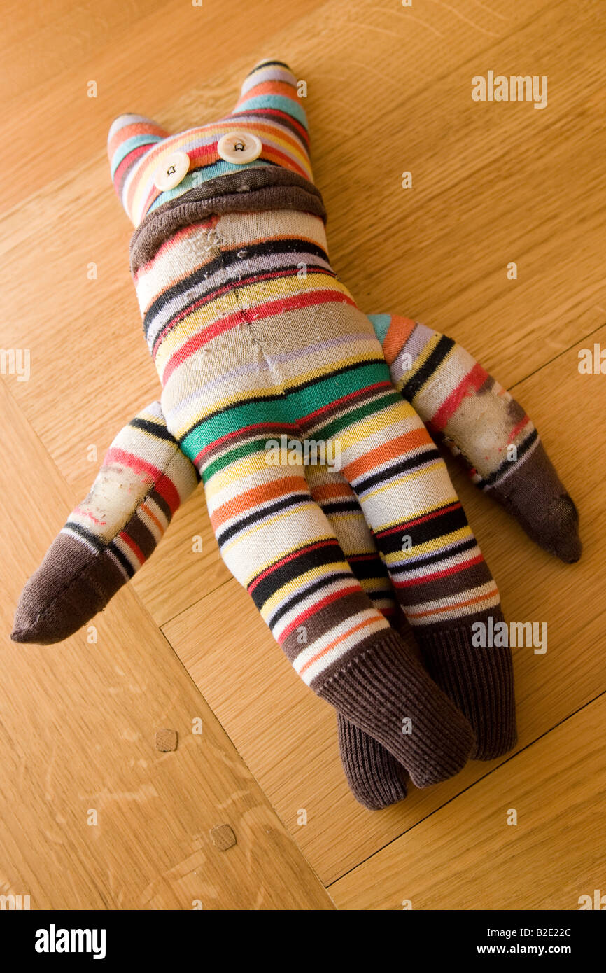 Hand made sock puppet toy with buttons for eyes Stock Photo Alamy