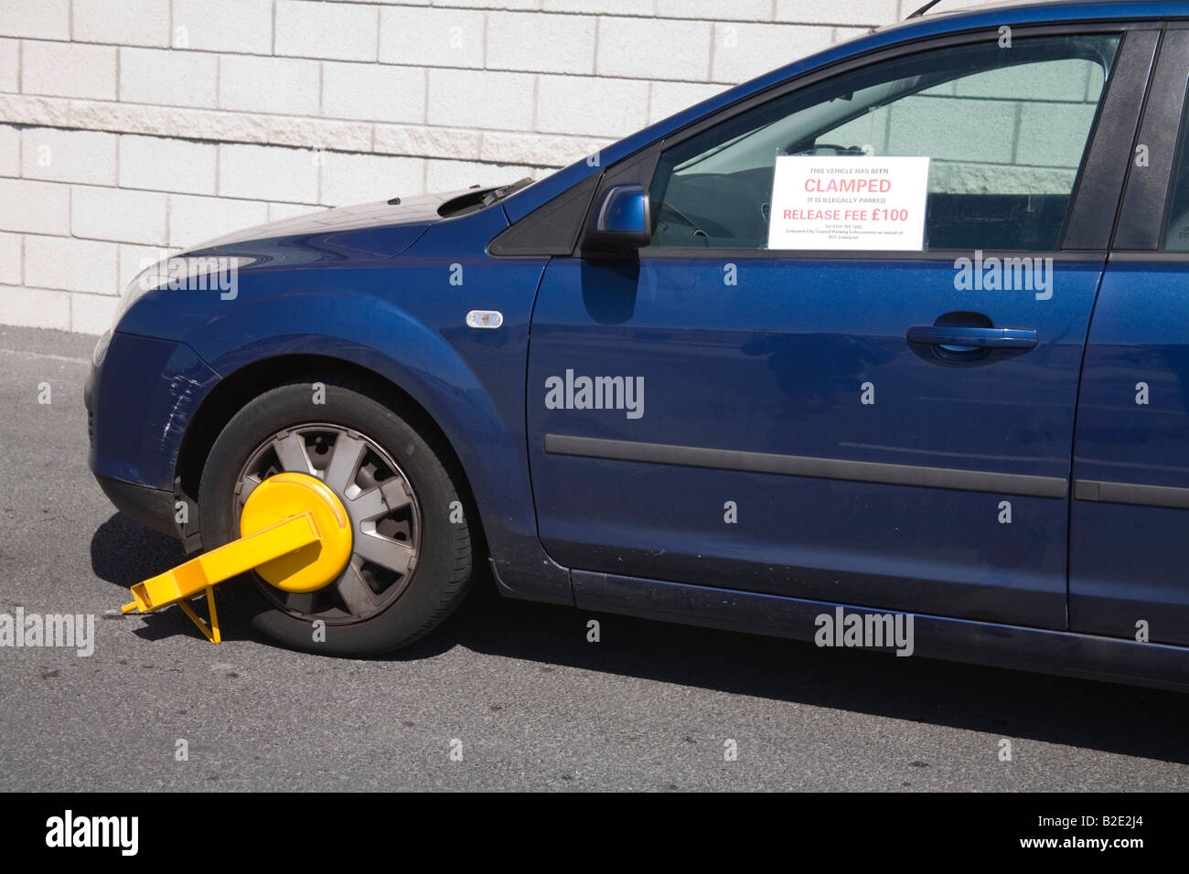 Car wheel clamped illegal parking hires stock photography and images