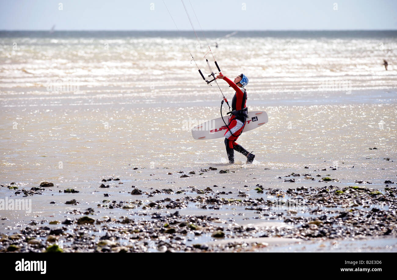 kite surfers on Goring beach near Worthing walking along the foreshore. Picture by Jim Holden. Stock Photo