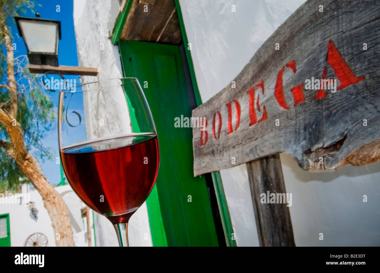 Spanish wine tasting Bodega Red wine glass and rustic Bodega sign
