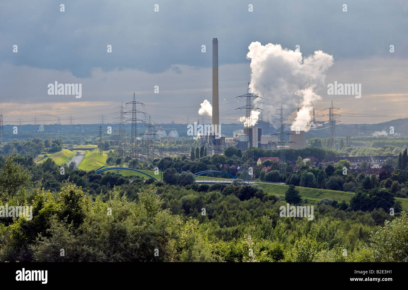Emscher River waste water canal, Bostrop, Ruhr Valley, Germany. Garbage combustion power plant Essen-Karnap run by RWE Power AG Stock Photo
