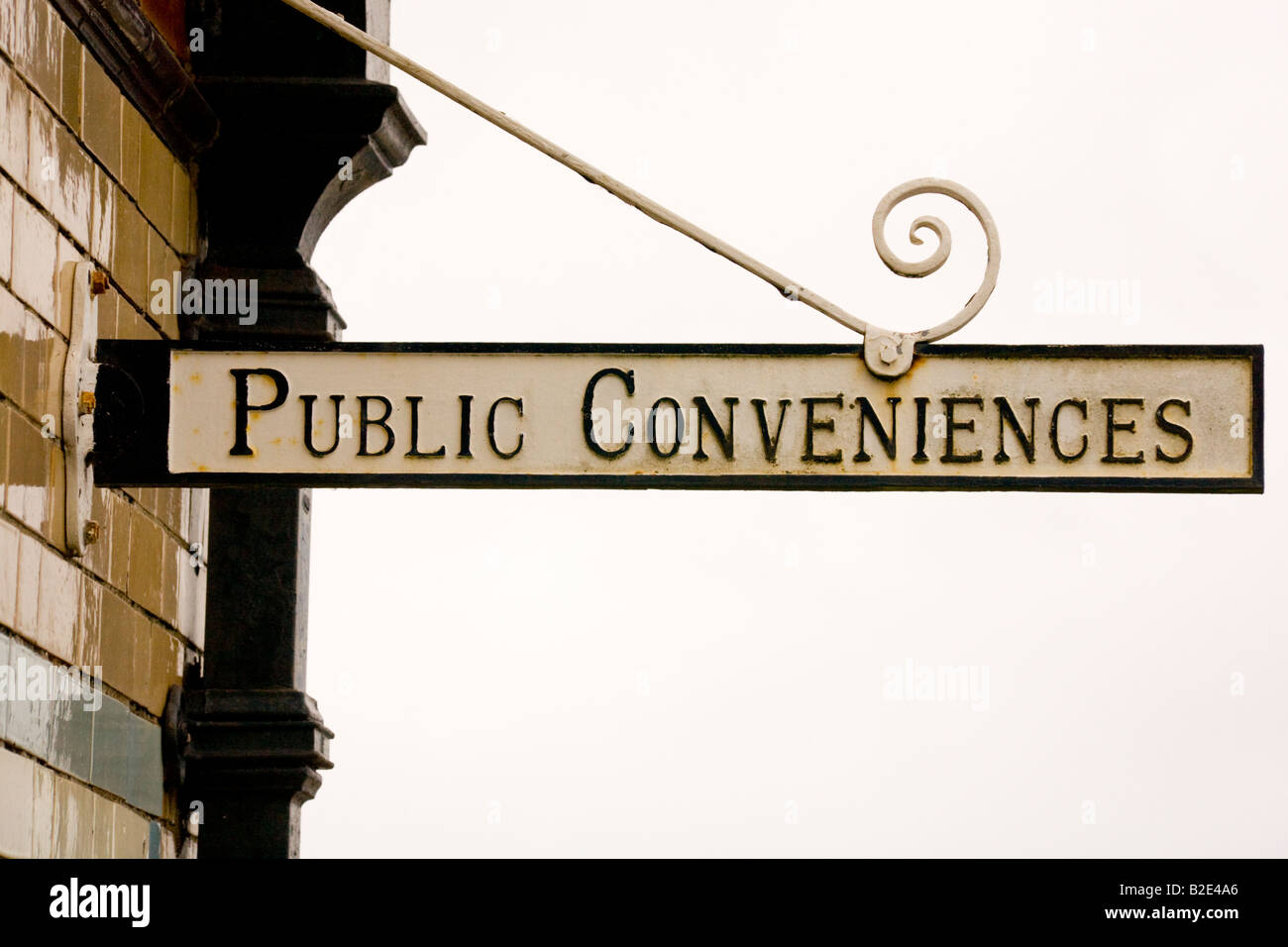 Old public conveniences sign hanging outside a public toilet. Scotland