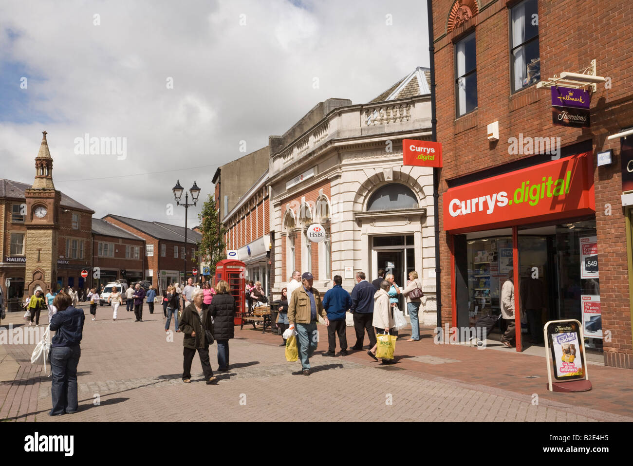 Currys shop and people in pedestrianised small town centre. Ormskirk Lancashire England UK Stock Photo