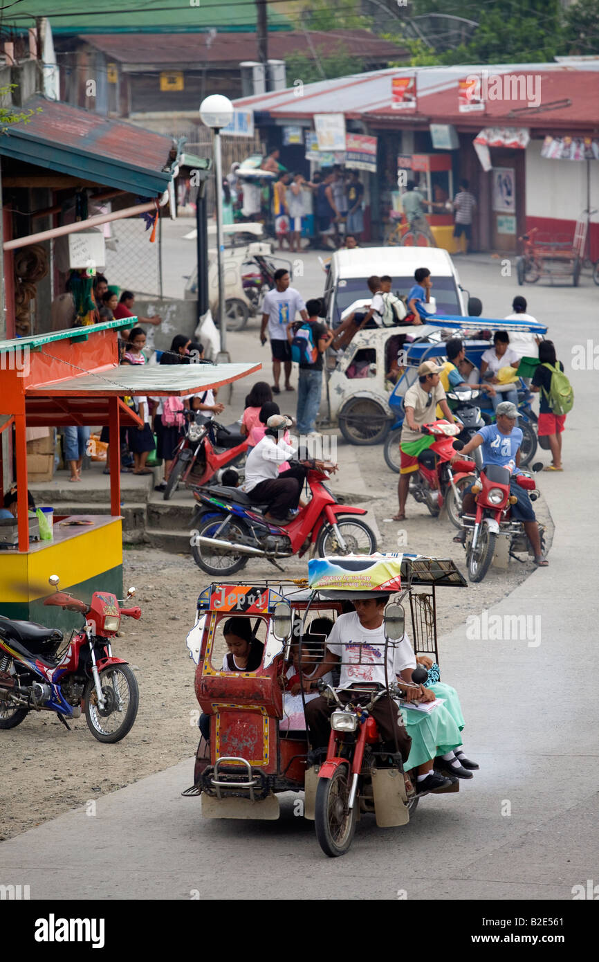 Afternoon traffic in Mansalay, Oriental Mindoro, Philippines. Stock Photo