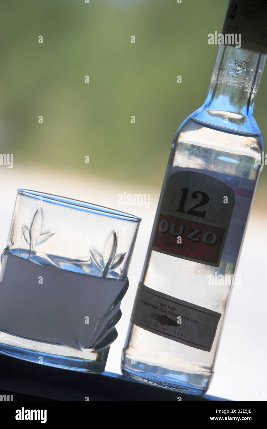 A glass and bottle of Ouzo Crete Greece Stock Photo Alamy