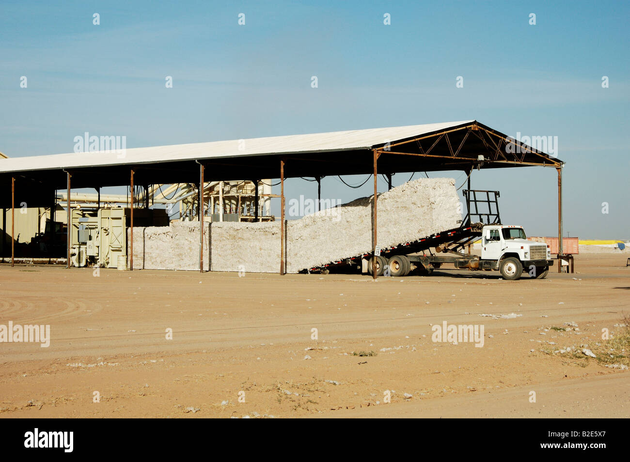 modules of harvested cotton being unloaded at a cotton gin in Arizona winter 2006 Stock Photo