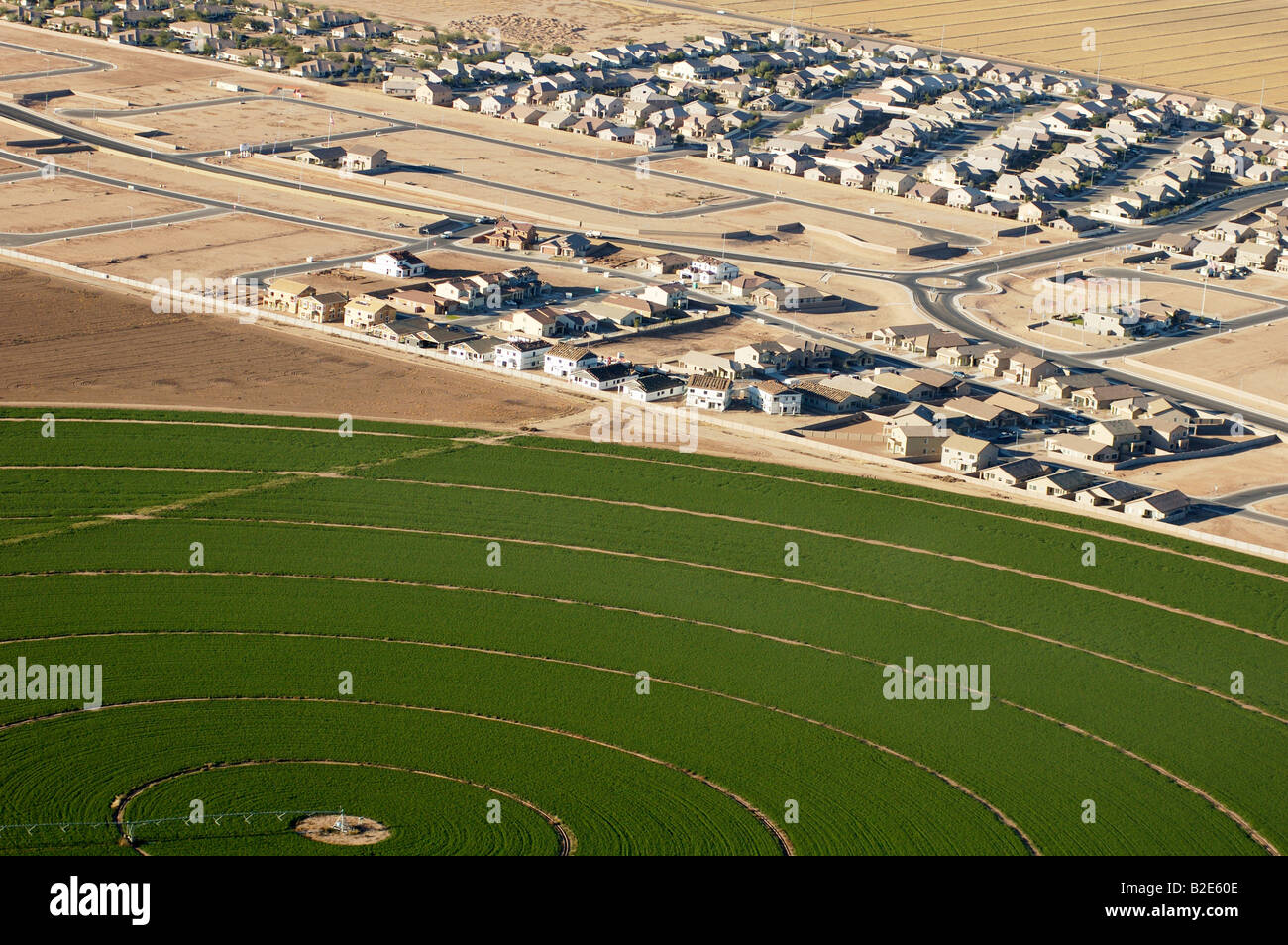 Aerial view of a new housing development on the edge of farm crops near