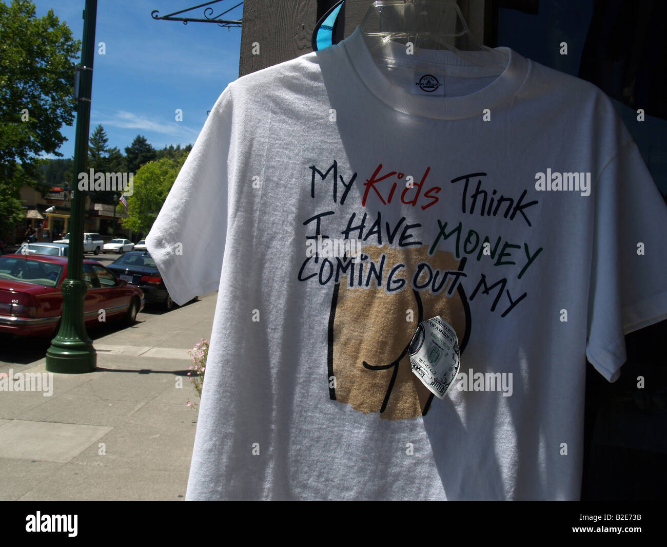Funny t-shirt hanging outside a novelty shop Stock Photo