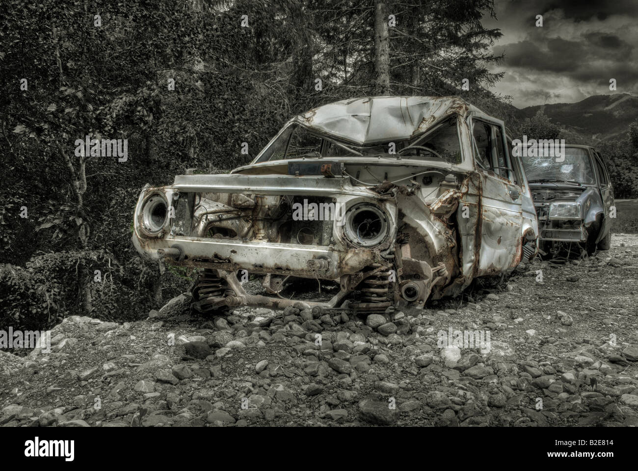 Scrap car - abandoned in the woods Stock Photo