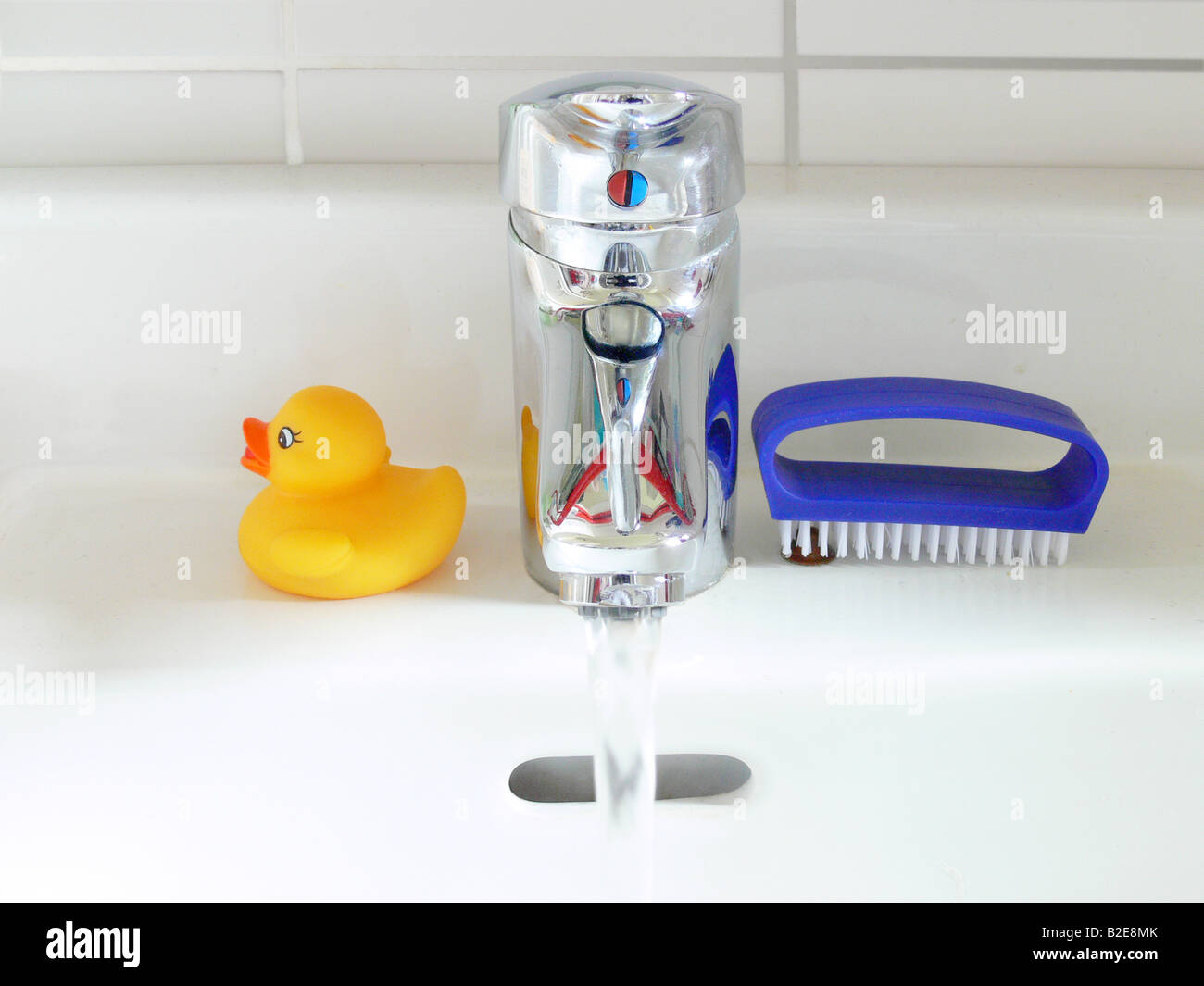Close-up of water flowing out of faucet Stock Photo