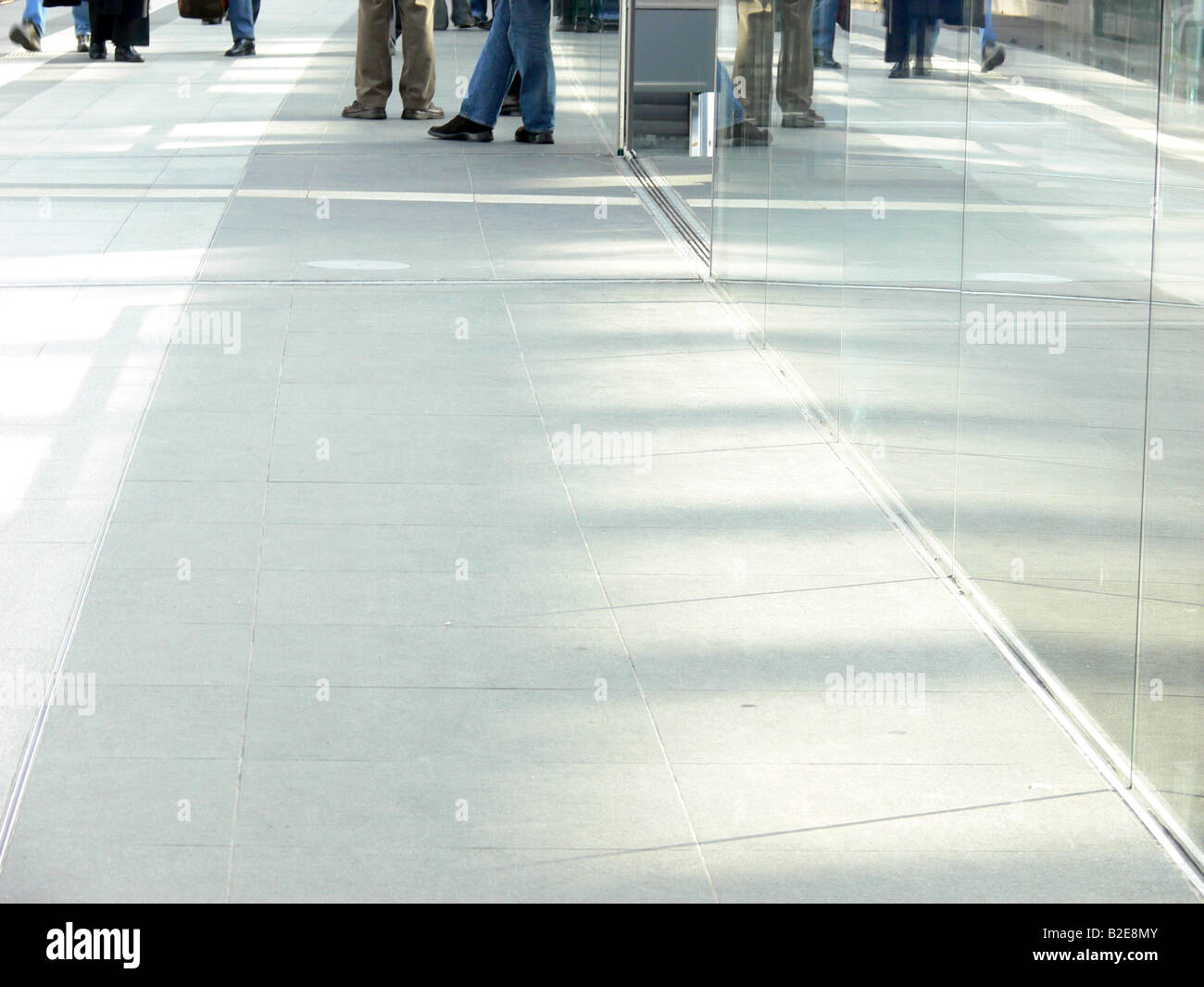 Reflection of glass wall on tiled flooring Stock Photo