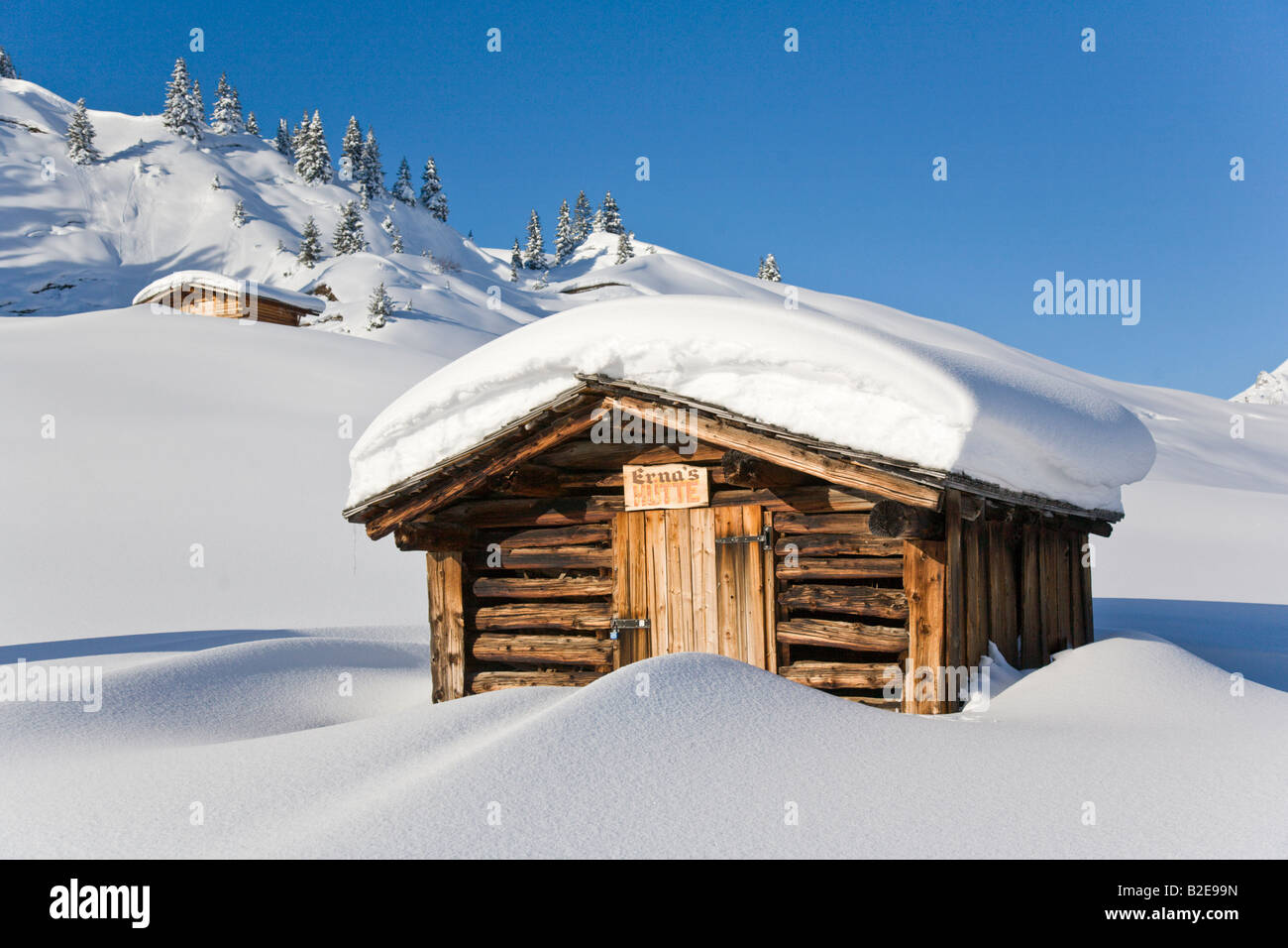 Log cabins on polar landscape, Schlegelkopf, Lech am Arlberg, Vorarlberg, Tyrol, Austria Stock Photo