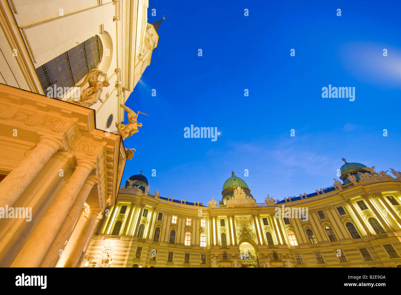 Palace and church lit up at dusk, Michaeler Platz, St. Michael's Church, Hofburg Imperial Palace, Vienna, Austria Stock Photo
