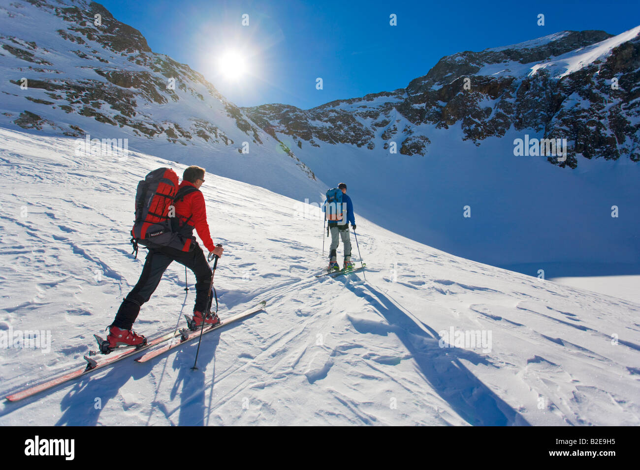 Two skiers skiing Ennstal Obersteiermark Obertal Vetternspitze Sauberg Austria Stock Photo