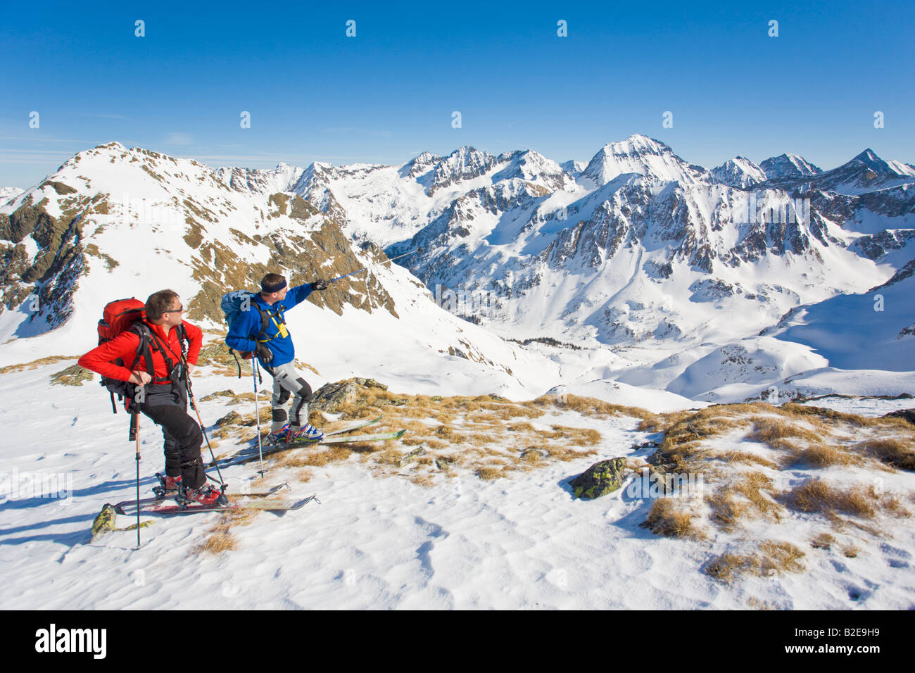 Two mountaineers standing on polar landscape Ennstal Obersteiermark Obertal Vetternspitze Austria Stock Photo