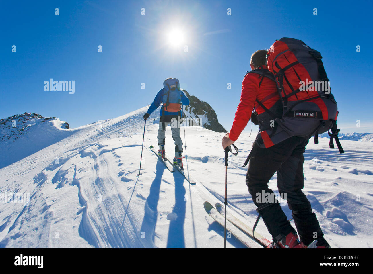 Rear view of two mountaineers walking on polar landscape Ennstal Obersteiermark Obertal Vetternspitze Austria Stock Photo
