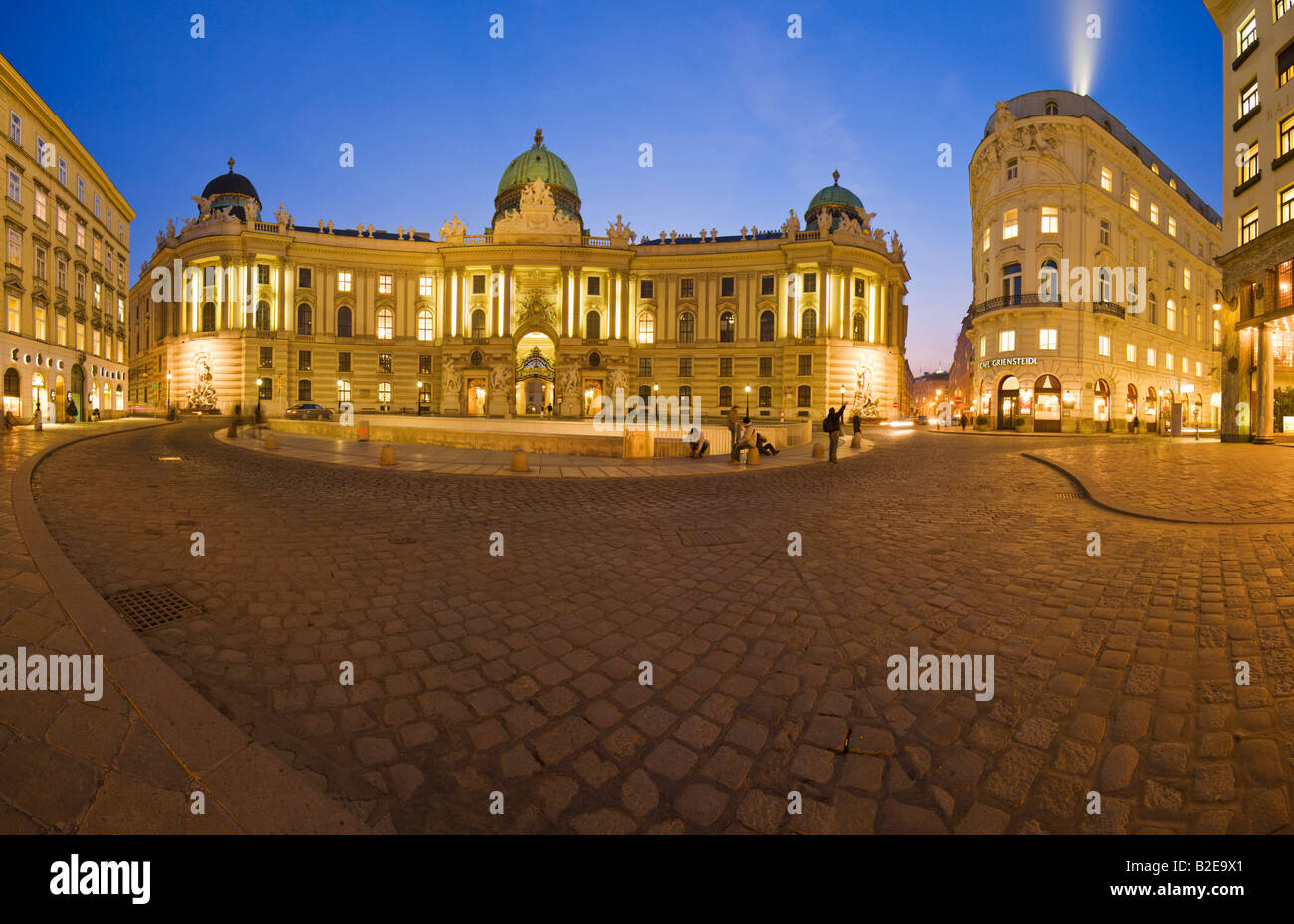 Palace and coffeehouse lit up at night Michaeler Platz Cafe Griensteidl Hofburg Imperial Palace Vienna Austria Stock Photo