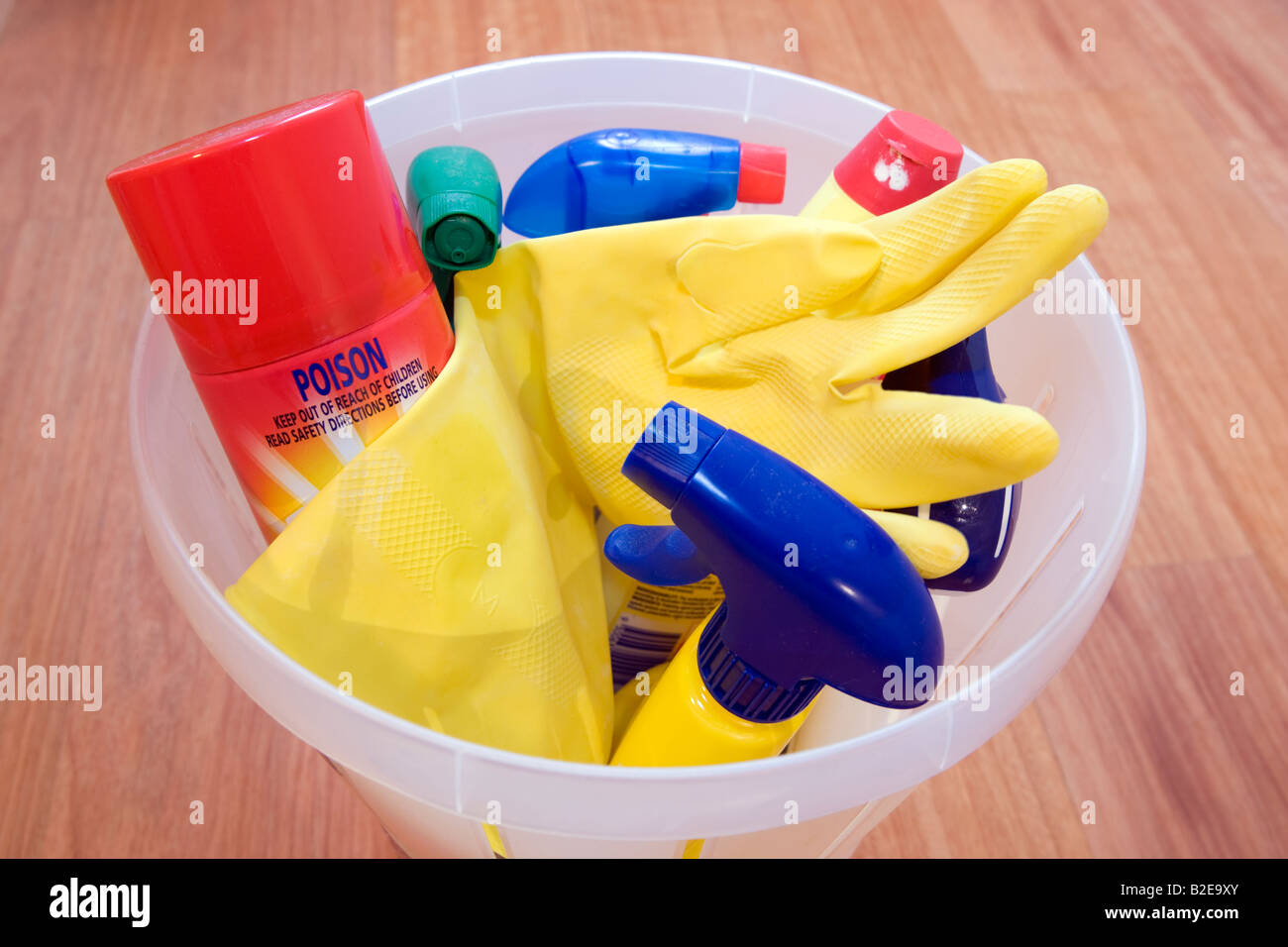 Chemical based, poisonous cleaning products and an old rubber glove in