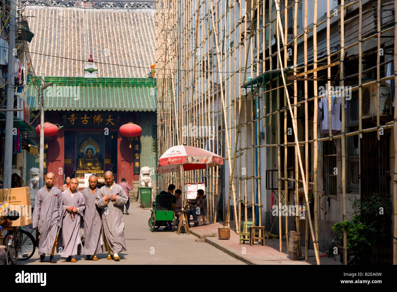 People walking in street Guangzhou Guangdong Province China Stock Photo