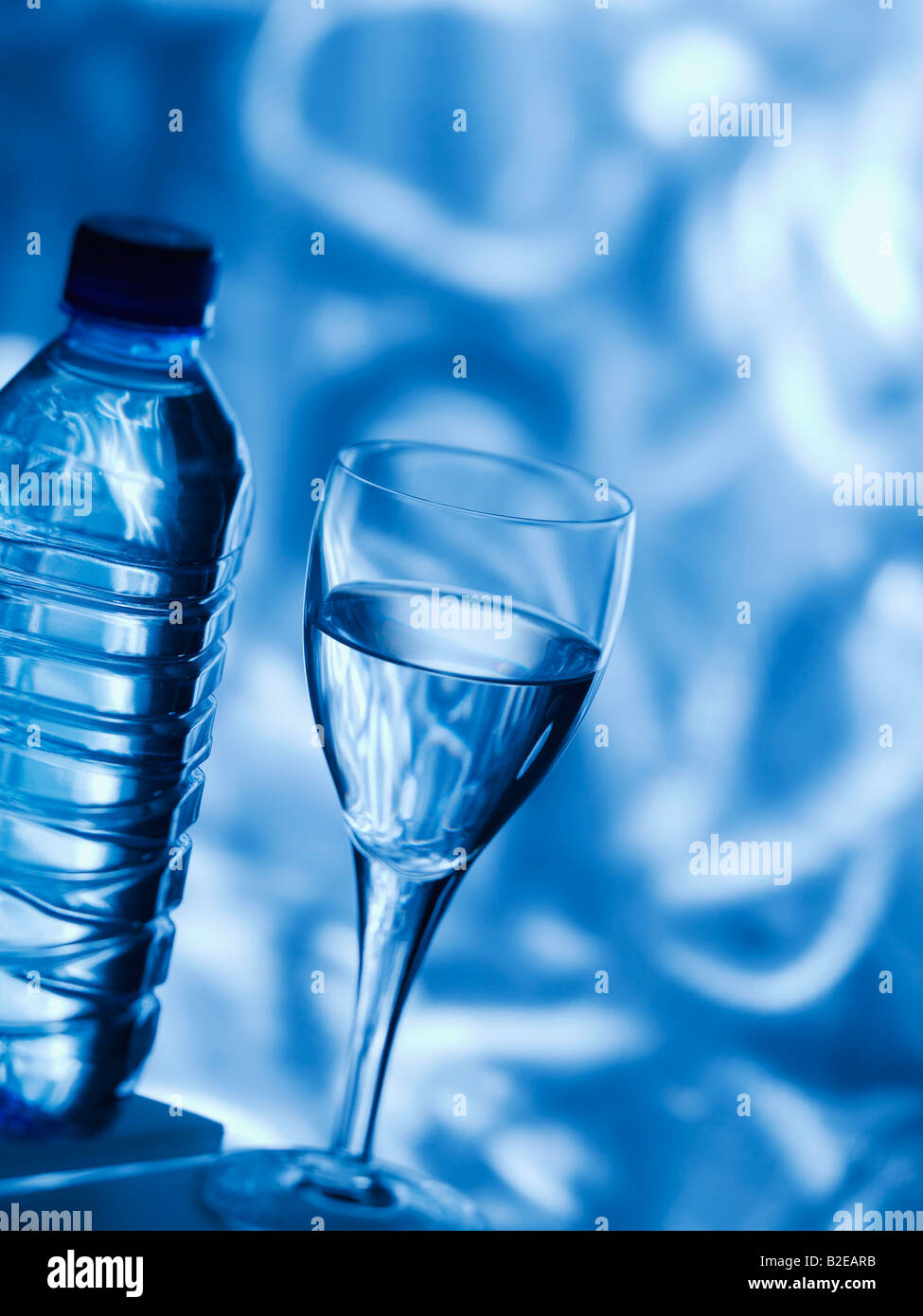 Close-up of water glass and bottle Stock Photo