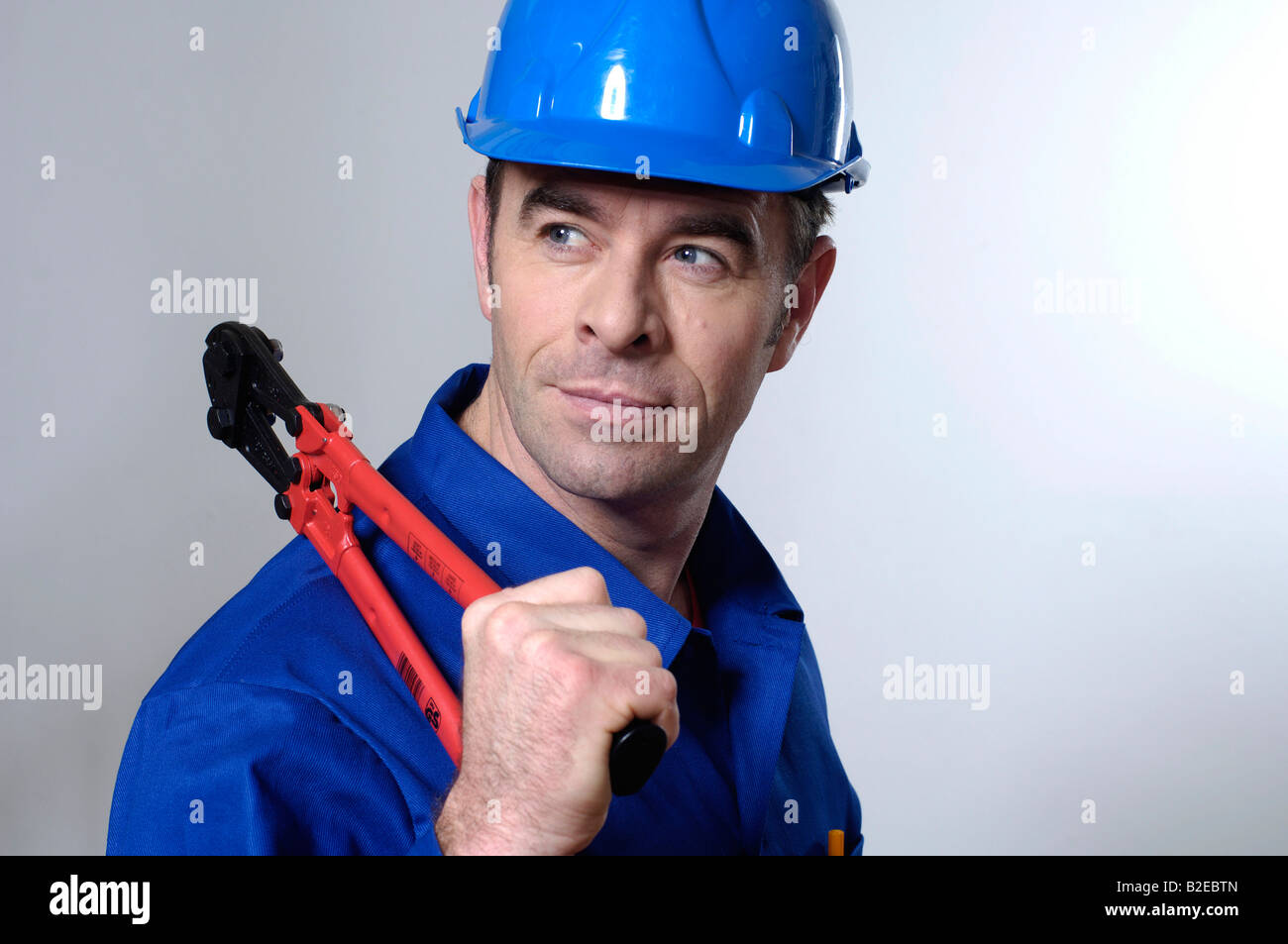 Close-up of man holding pliers Stock Photo