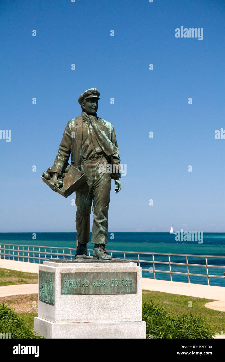 A statue of Thomas Edison by local artist Mino Duffy along the St Clair River at Port Huron Michigan Stock Photo