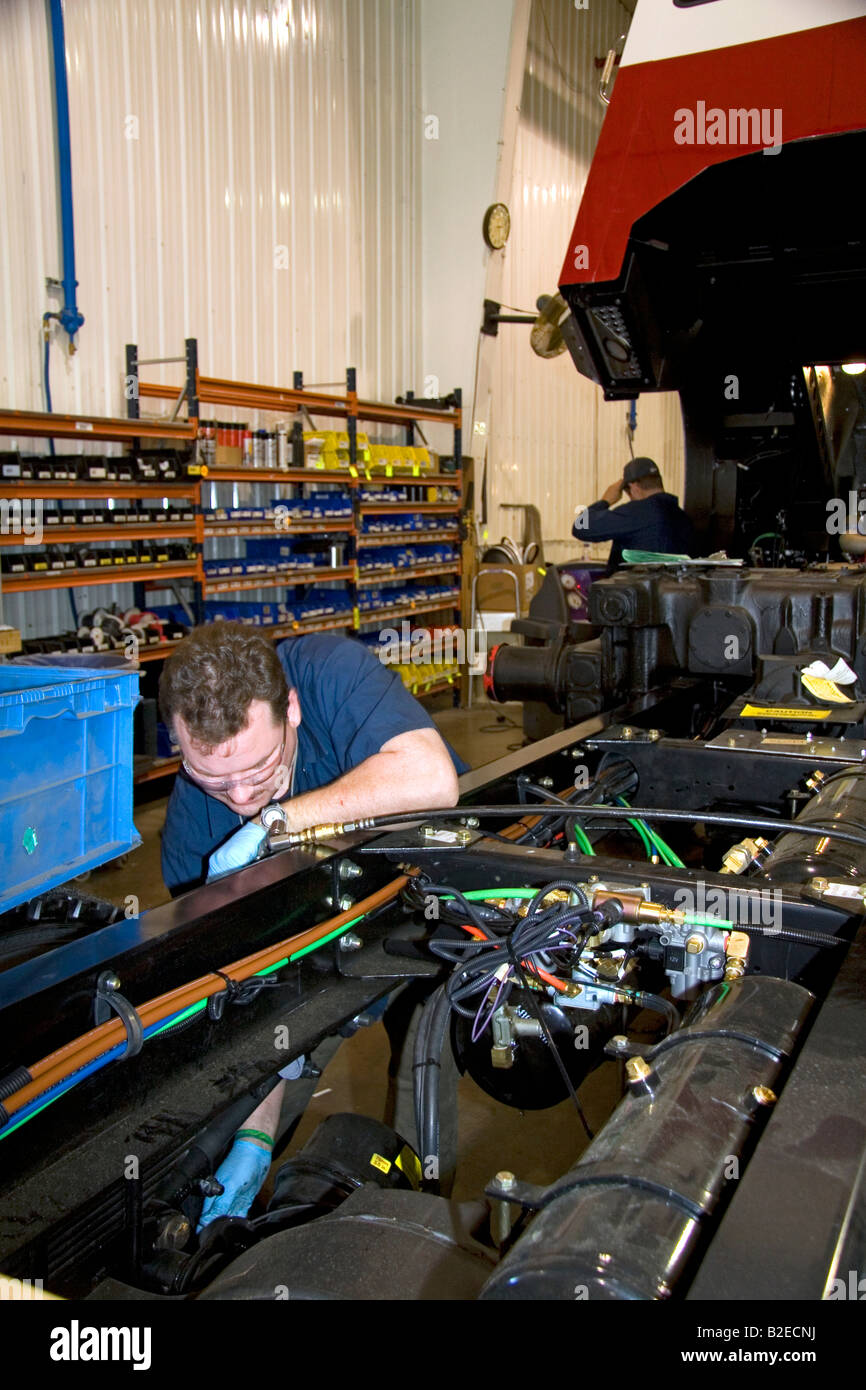 Worker manufacturing a truck chassis at Spartan Motors in Charlotte