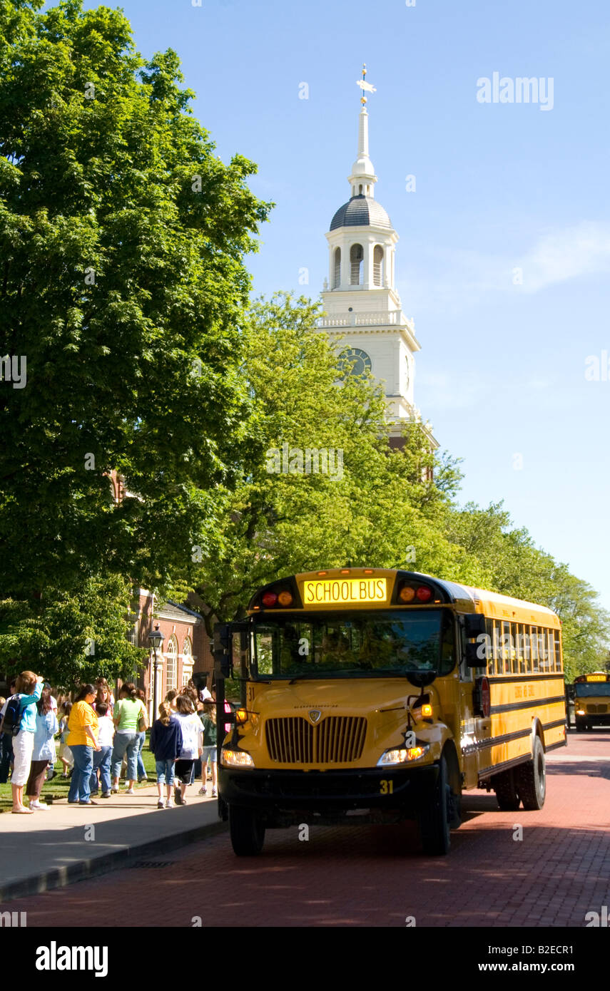 School bus parked in front of the Independence Hall replica at The Henry Ford Museum in Dearborn Michigan Stock Photo