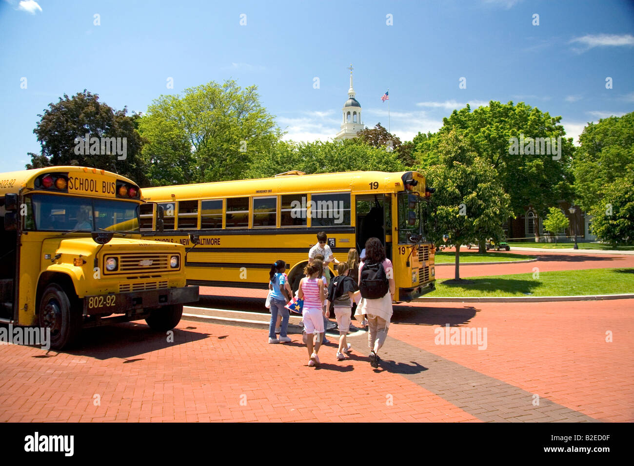 Children board a school bus at The Henry Ford in Dearborn Michigan Stock Photo
