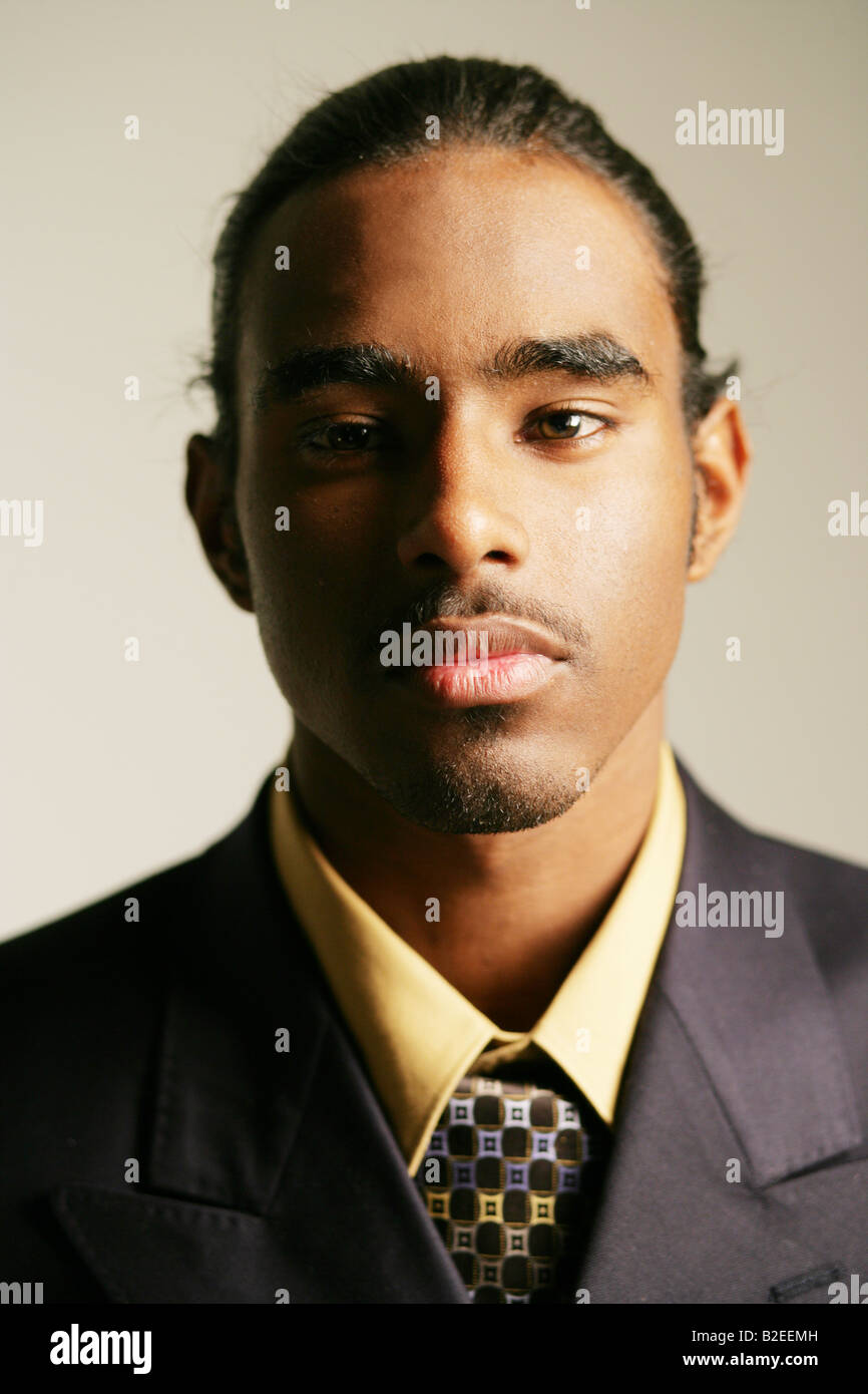 Young African American man in full suit, portrait Stock Photo - Alamy