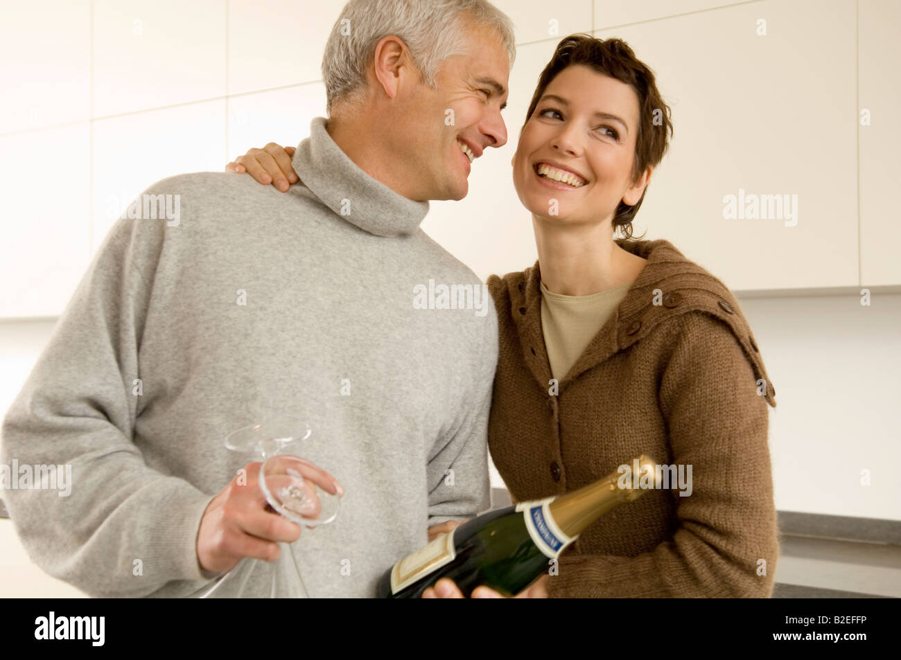 Mature man and a mid adult woman smiling Stock Photo
