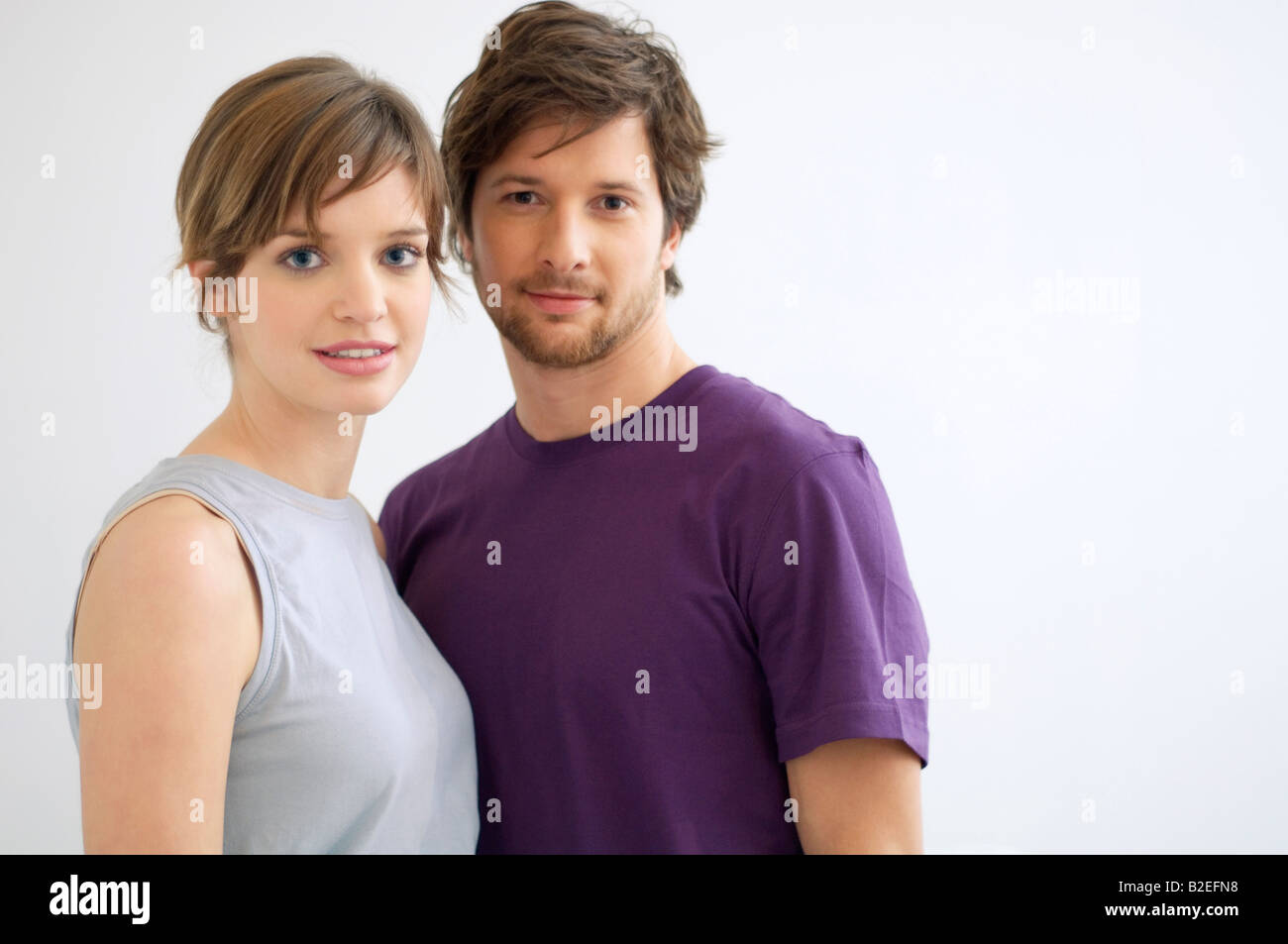 Portrait of a mid adult man and a young woman smiling Stock Photo - Alamy