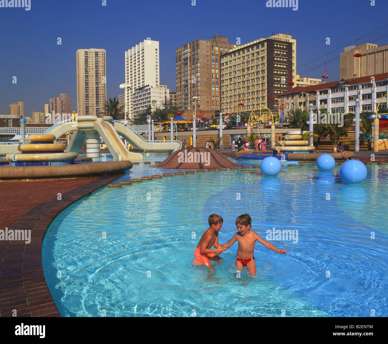 Two small kids paddling in the Beachfront Paddling Pools on Durban