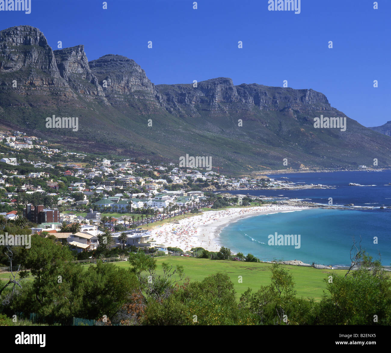 View over Campsbay residential area and beach with Twelve Apostles in the background Stock Photo