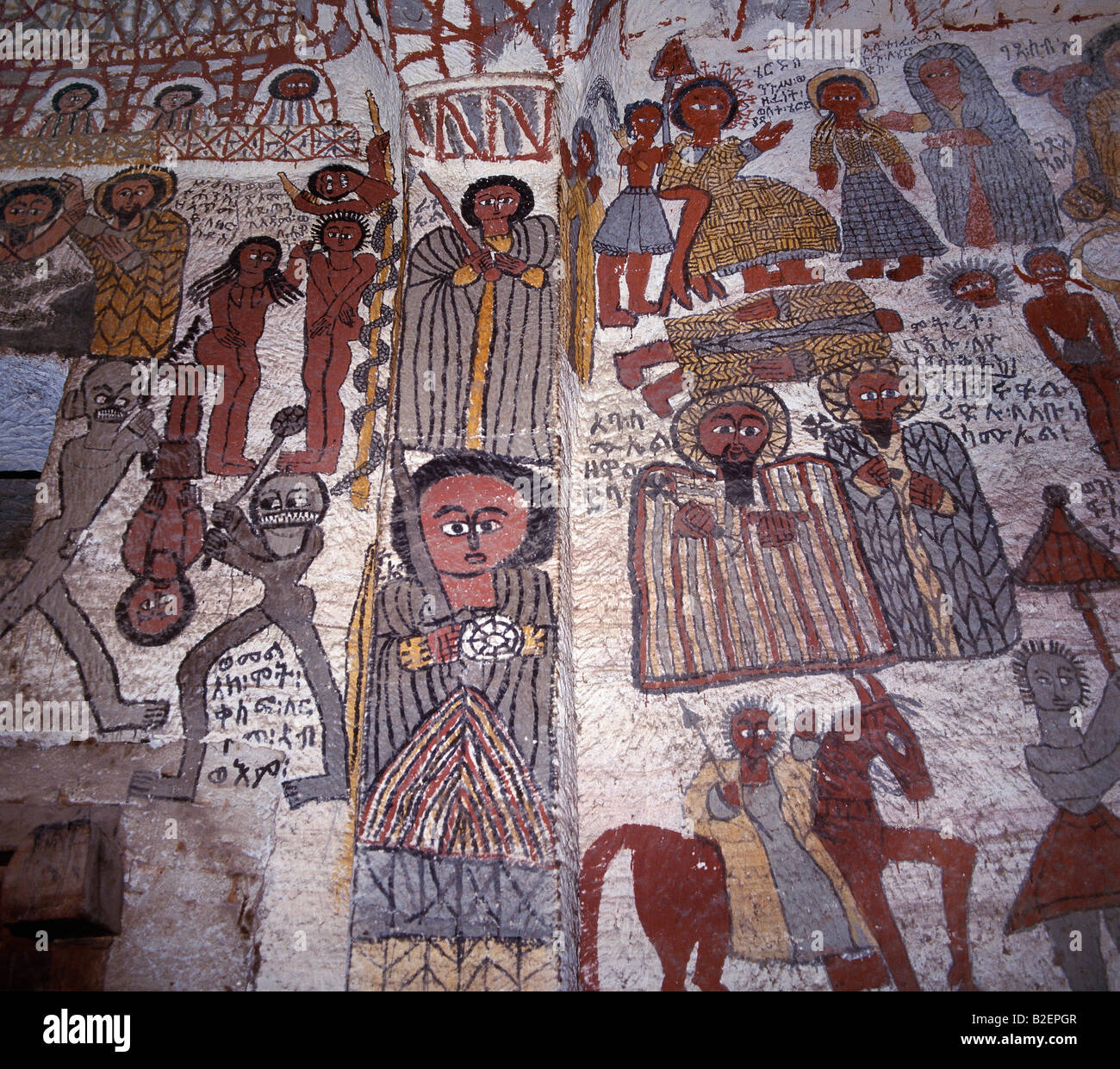 Fine murals decorate the interior of the rock-hewn church of Yohannes Maequddi, a two-hour walk from Degum. Stock Photo
