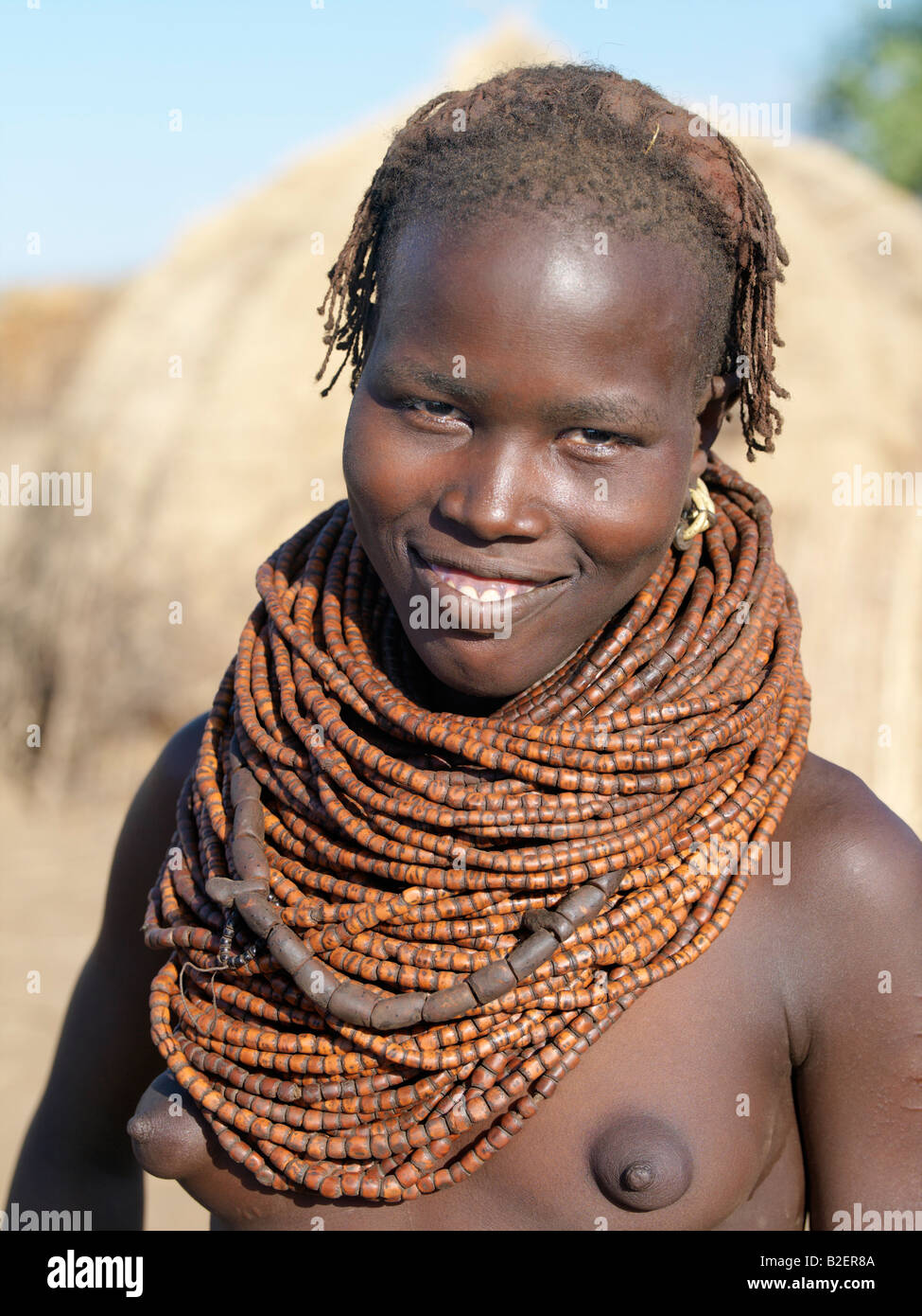 A Nyag'atom girl with a large necklace, the beads of which are made of wood.The Nyag'atom are one of the largest tribes. Stock Photo