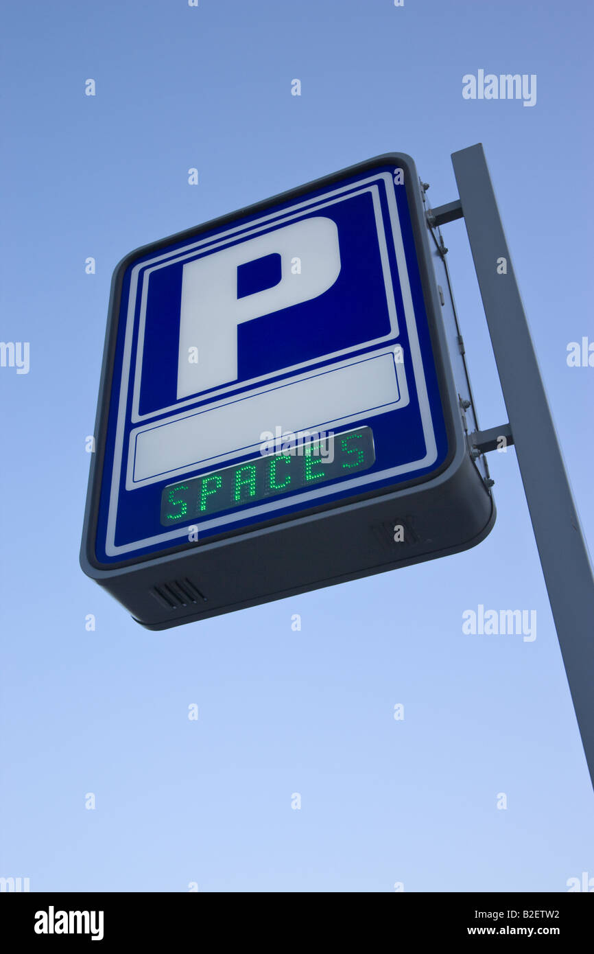 Parking garage sign advertising spaces available Stock Photo Alamy