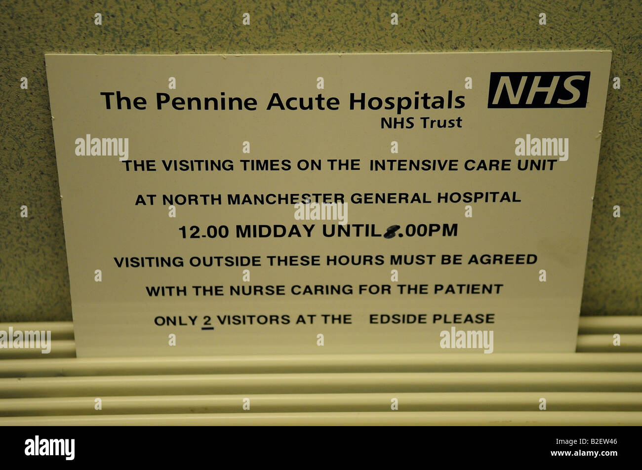 visiting times intensive care unit sign wall detail hospital nhs north manchester general hospital Stock Photo