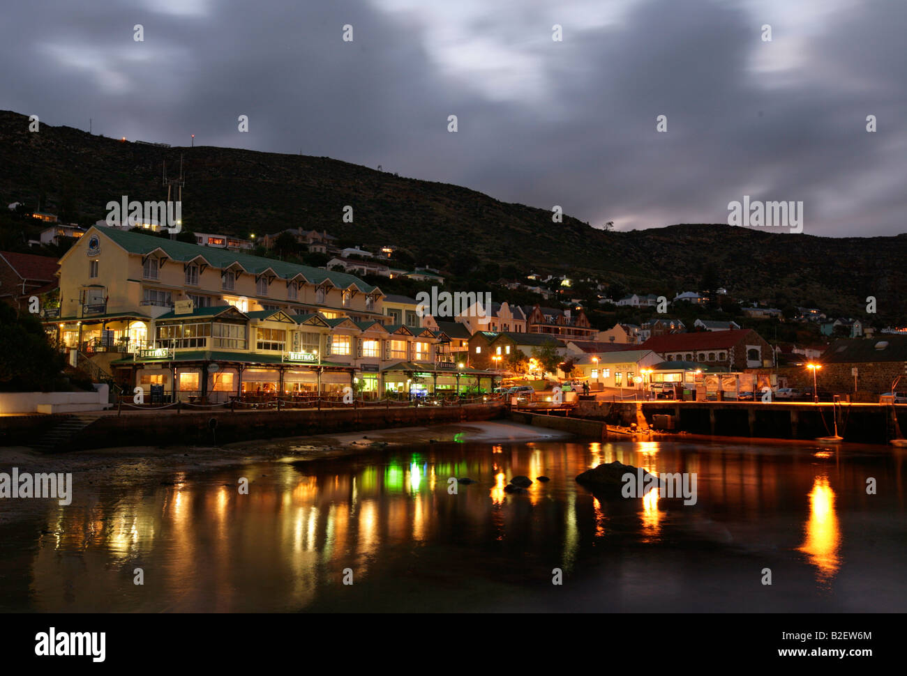 Lights reflected in the water at night at the Simon's town waterfront Stock Photo