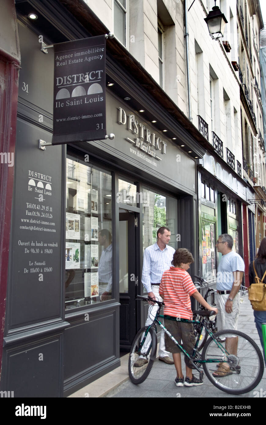 Paris France ,Man and boy, Talking to Client Outside Shop "Real Estate