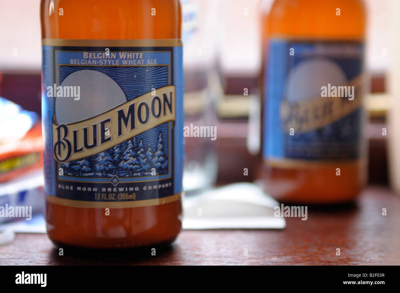 blue moon belgian beer bottles two drink alcohol Stock Photo