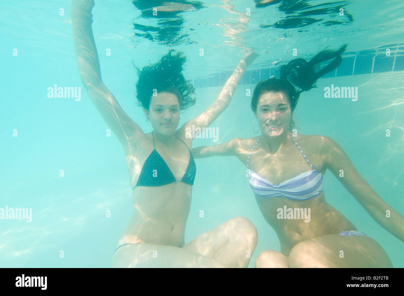 Caribbean Dominican Republic Barcelo Punta Cana all inclusive resort Young women in pool underwater Stock Photo