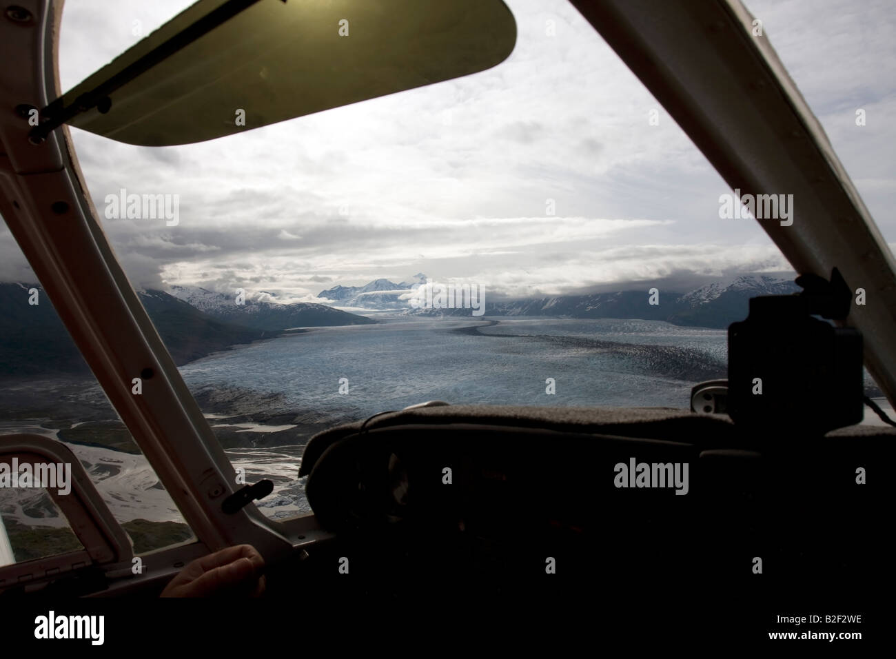 Flight seeing trip with a small air plane plane over the Knik River valley and Knik River Glacier, Alaska, USA Stock Photo